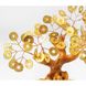 Tree with golden coins in a bag